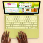 Top view of MacBook Neo with vibrant display and sleek lime design, showcasing modern portable computing innovation